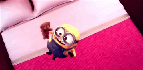 Minion jumping on a bed